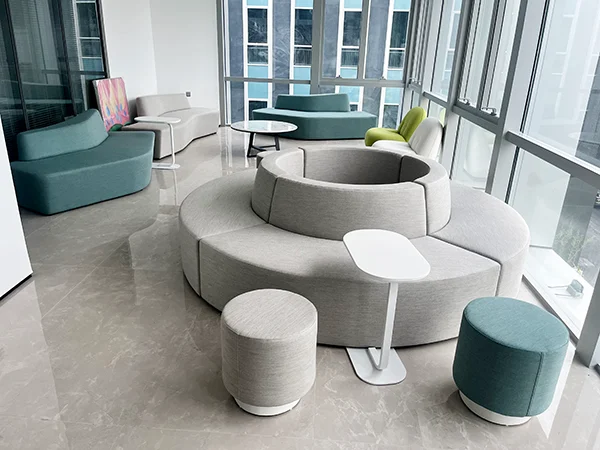Commercial office project, large circular modular fabric sofa for open office collaboration zone