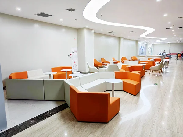 Commercial lobby project, orange and white modular corner sofa system for large public waiting lounge
