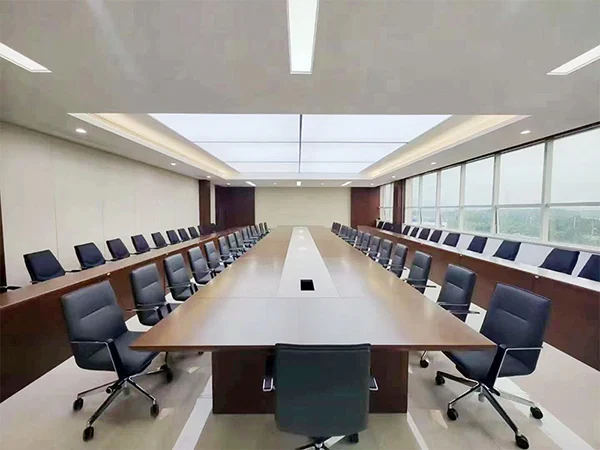 Commercial large meeting room project, long conference table paired with dark leather office conference chairs