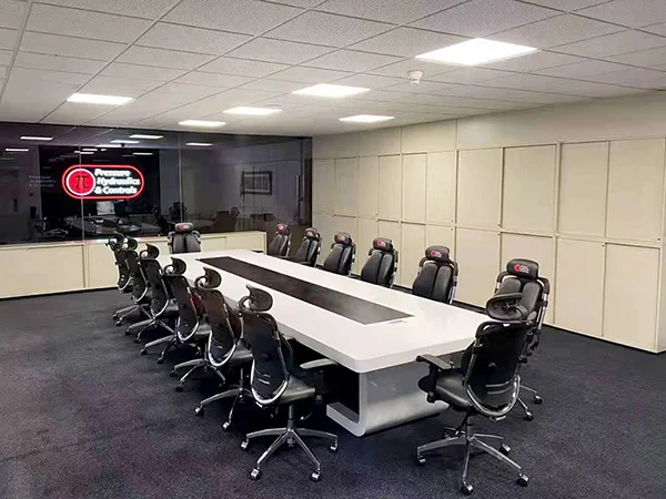 Commercial office project, modern meeting room equipped with black mesh ergonomic conference chairs