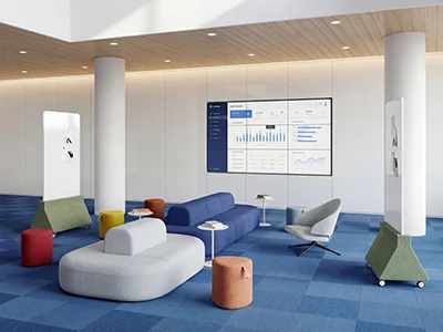 Modern breakout zone with modular curved office sofas and casual collaborative seating
