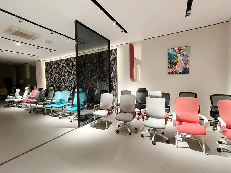 Various colorful ergonomic mesh office chairs displayed in kepospace furniture showroom